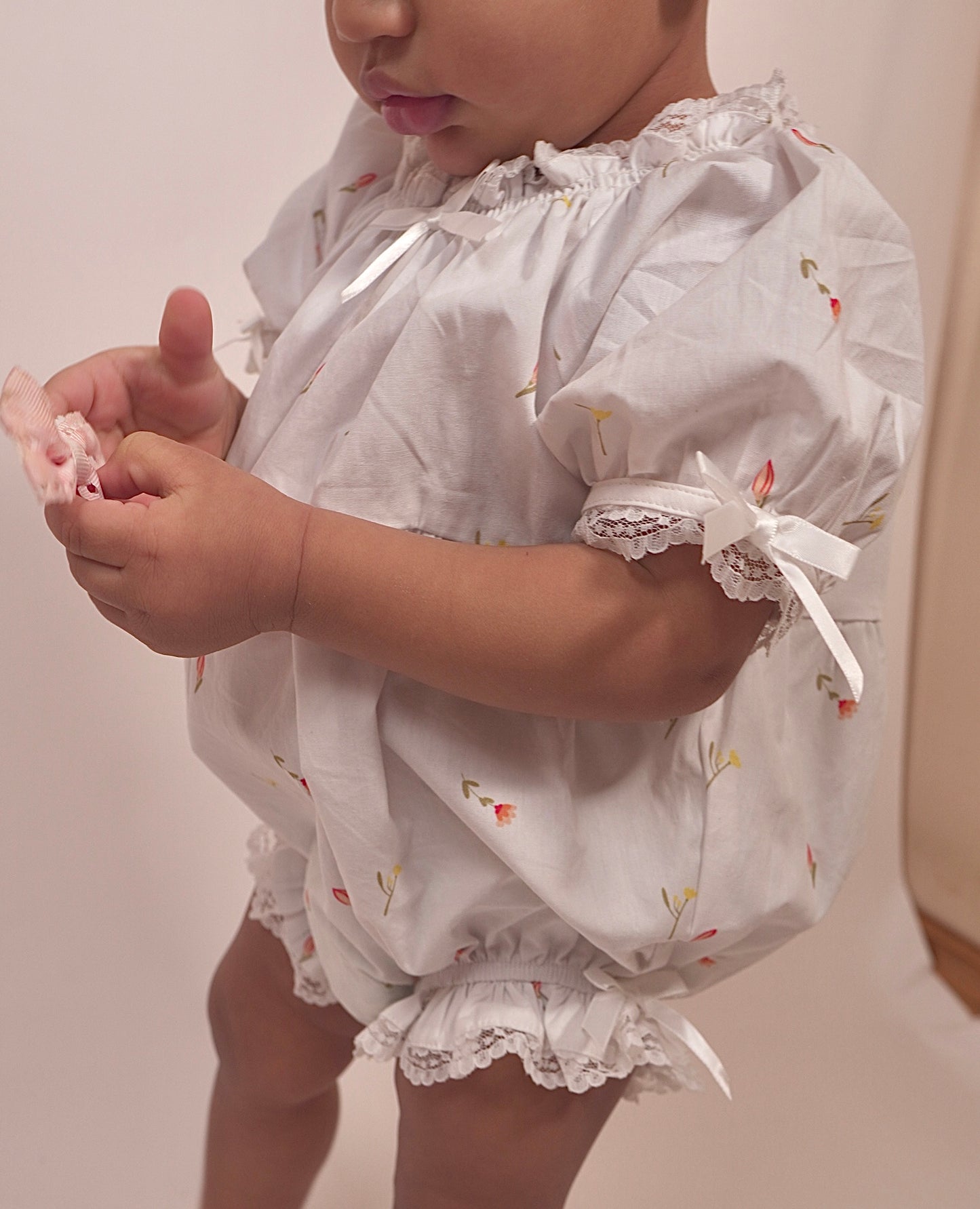The Lumi Baby Girl Onesie