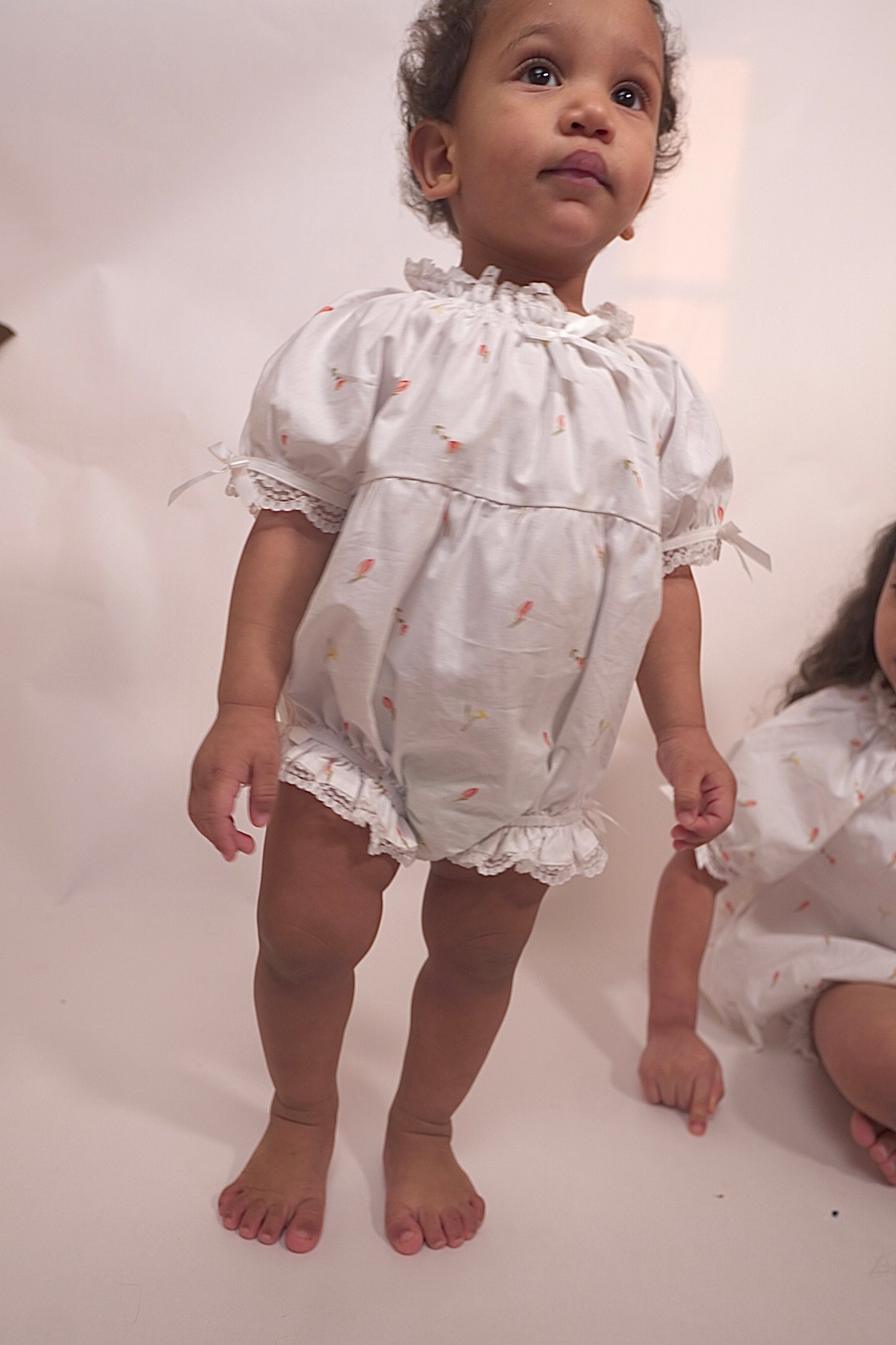 The Lumi Baby Girl Onesie